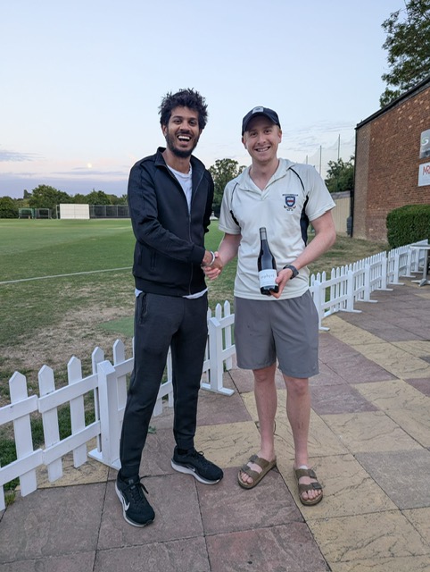 Cal and Nik receive their player of the match awards